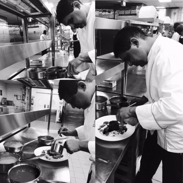 Chef Sameer Sehgal plating in a professional kitchen