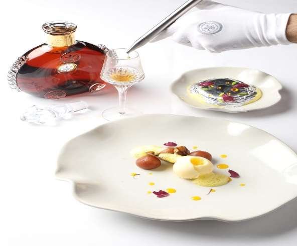Louis XIII poured tableside beside Indian plates