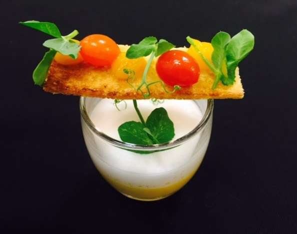 Amuse-bouche in a glass with a tomato crisp