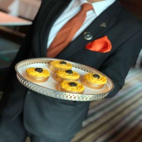 Caviar tarts on a silver tray