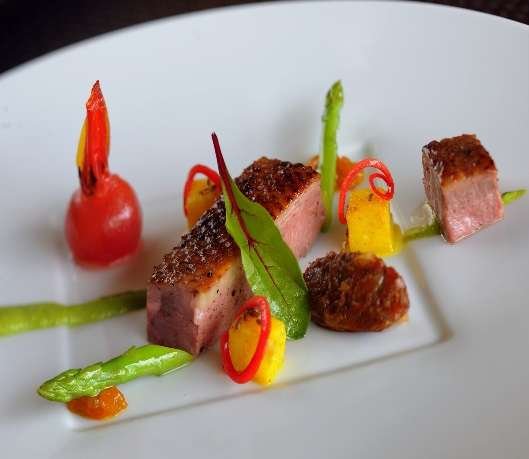 Sous-vide duck with confit jhalfrezi and cumin potatoes